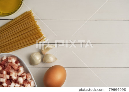 Cooking ingredients for italian carbonara on rustic surface. 79664998