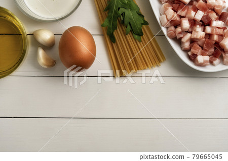 Cooking ingredients for italian carbonara on rustic surface. 79665045