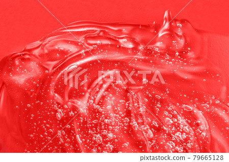 Hyaluronic acid toner swatch. Transparent cream sample smudge with collagen and vitamin. Serum liquid cosmetics, jelly cosmetic product. Red moisturizer smear. Gel texture with bubbles. Closeup 79665128