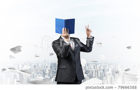 Businessman covered his face with organizer 79666388