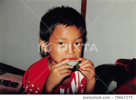 Old film photo: A little boy eating watermelon Old film photo: A little boy eating watermelon 79667275