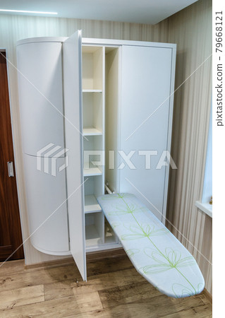 Modern furniture in a minimalist design executed in white color in a home interior. 79668121