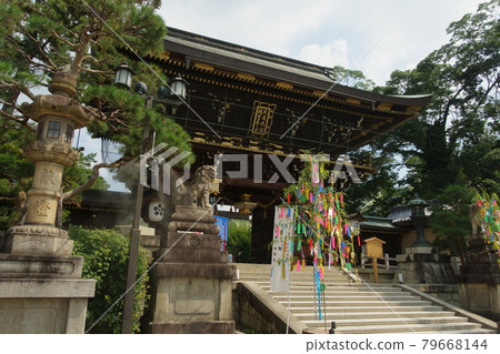 A summer scene of the gate of Kitano Tenmangu Shrine in Kyoto and the Tanabata Festival paper strips decorated on it A summer scene of the gate of Kitano Tenmangu Shrine in Kyoto and the Tanabata Festival paper strips decorated on it 79668144
