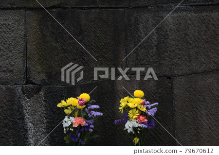 Flower offerings at the statue of Kannon Bodhisattva in the grounds of Sensoji Temple in Asakusa, Tokyo Flower offerings at the statue of Kannon Bodhisattva in the grounds of Sensoji Temple in Asakusa, Tokyo 79670612
