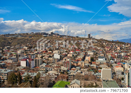 Panorama of a densely populated city. Tbilisi city landscape from above Panorama of a densely populated city. Tbilisi city landscape from above 79671700