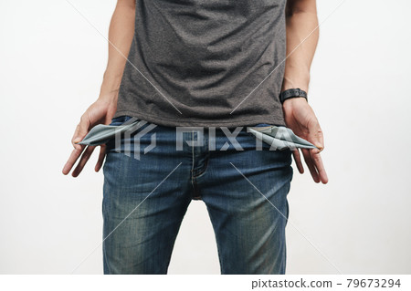 Man turning out the jean pocket to showing empty pocket. bankrupt, bad economy, no money concept. Man turning out the jean pocket to showing empty pocket. bankrupt, bad economy, no money concept. 79673294
