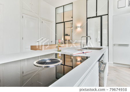 Interior of a beautiful kitchen of an elite house Interior of a beautiful kitchen of an elite house 79674938