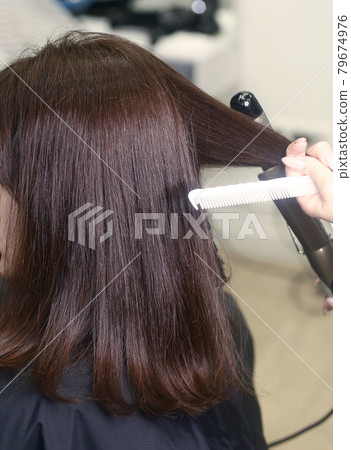 hairdresser hand with hair dye making haircut and hair coloring on client closeup photo hairdresser hand with hair dye making haircut and hair coloring on client closeup photo 79674976