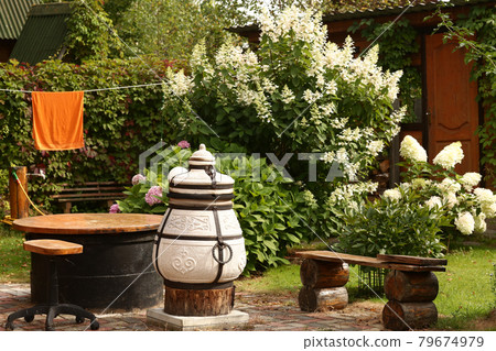 beautiful formal garden with dining place, table tandoor bench beautiful formal garden with dining place, table tandoor bench 79674979