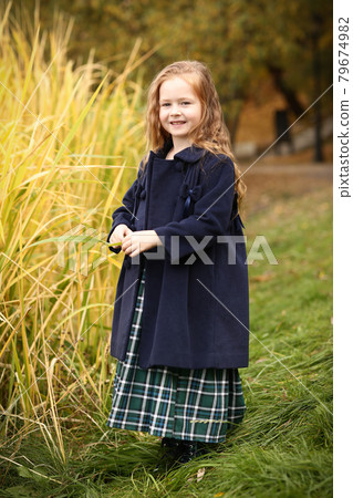 Irish little girl outdoor photo on fall landscape background Irish little girl outdoor photo on fall landscape background 79674982
