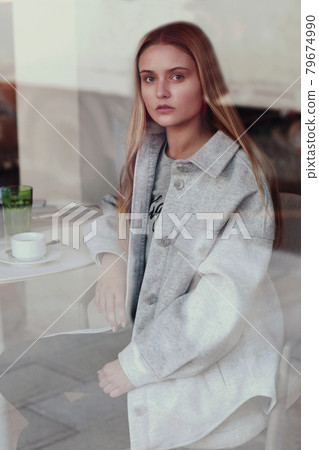 blond long hair beautiful girl with cup of coffee close up portrait blond long hair beautiful girl with cup of coffee close up portrait 79674990