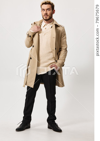 guy in dark trousers and an unbuttoned coat bushy beard blond model guy in dark trousers and an unbuttoned coat bushy beard blond model 79675679