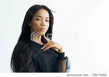 fashionable woman african appearance black shirt long hair posing fashionable woman african appearance black shirt long hair posing 79675680