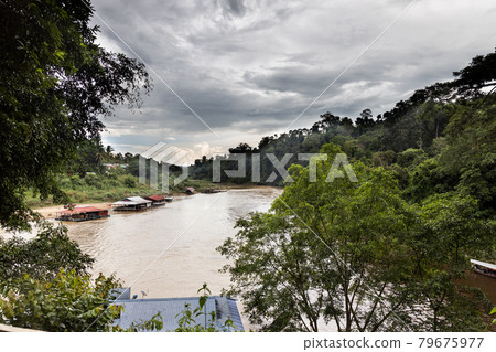 View of the scenic Sungai Tembeling river with floating restaurants at Taman Negara National Park, Pahang View of the scenic Sungai Tembeling river with floating restaurants at Taman Negara National Park, Pahang 79675977