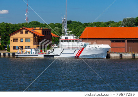 Swinoujscie. Marine ship at the city embankment. Swinoujscie. Marine ship at the city embankment. 79677289