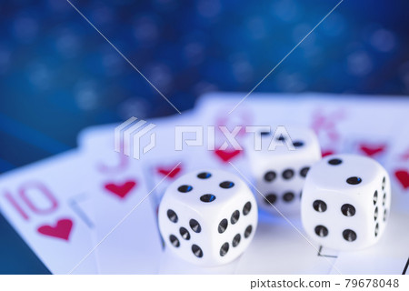 Online gaming platform, casino and gambling business. Cards and dice on laptop keyboard, toned in blue Online gaming platform, casino and gambling business. Cards and dice on laptop keyboard, toned in blue 79678048