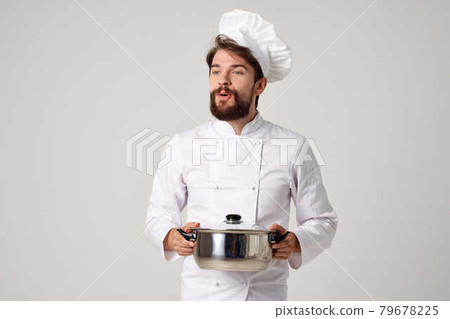 cheerful chef with a saucepan in his hands kitchen cooking work 79678225