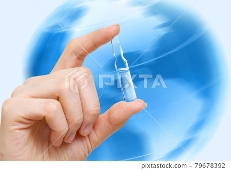 Medical ampoule for injection in hand on blue Earth planet background Medical ampoule for injection in hand on blue Earth planet background 79678392