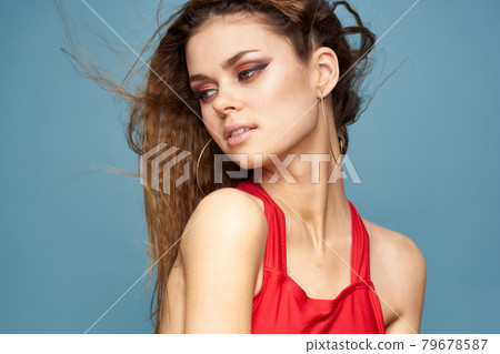 Attractive woman wavy hair charming look cosmetics elegant style blue background 79678587