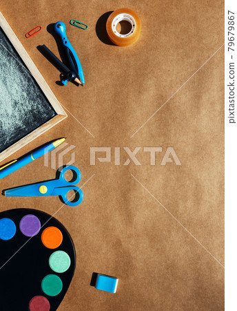Back to school bright concept, frame with colorful school supplies on brown background . Back to school bright concept, frame with colorful school supplies on brown background . 79679867
