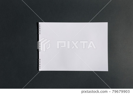 Piece of white album paper on black. Piece of white album paper on black. 79679903