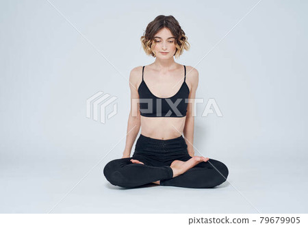 Meditation yoga woman asana light background crossed legs Meditation yoga woman asana light background crossed legs 79679905