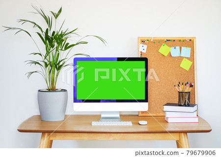 Workspace mockup blank screen laptop, cork board supplies and green palm home plant in pot on table. Workspace mockup blank screen laptop, cork board supplies and green palm home plant in pot on table. 79679906