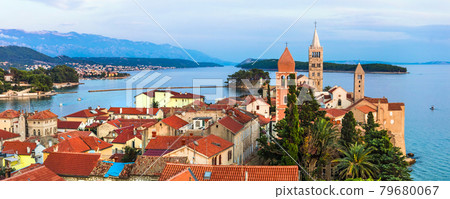 Beautiful Island Rab in Croatia. Townscape panorama over sunset. 79680067