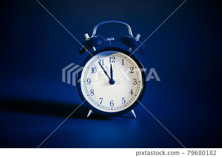 Analog clock on blue background Analog clock on blue background 79680182