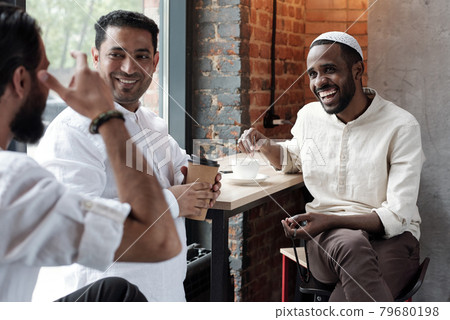 Muslim Friends Gathering In Cafe Muslim Friends Gathering In Cafe 79680198