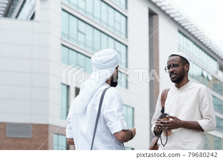 Men in Islamic Clothes Talking Outdoors Men in Islamic Clothes Talking Outdoors 79680242