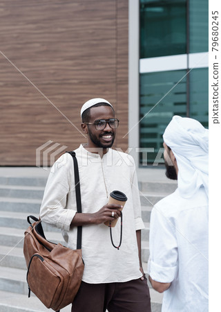 Muslim Colleagues Discussing Business Muslim Colleagues Discussing Business 79680245
