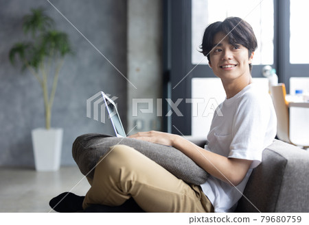 Young man relaxing in the room 79680759