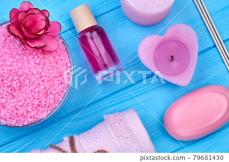 Flat lay accessories for body care on blue wooden desk. 79681430
