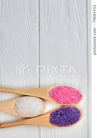 Set of three spoons with colored crystal salt and copy space. 79681452