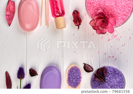 Flat lay spa treatment accessories on white wooden desk. 79681556