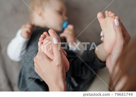 Massaging Feet Of Baby 79681749