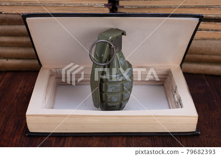 hand grenade hidden in a book hand grenade hidden in a book 79682393