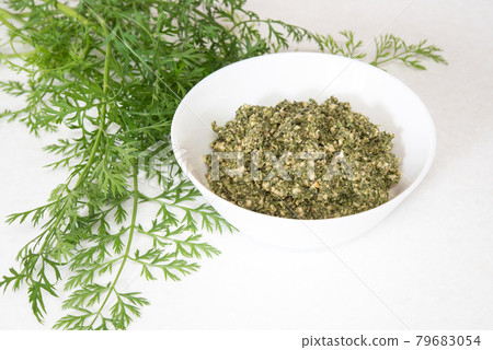 Oganic carrot top and walnut pesto dip sauce isolated on mable countertop. Healthy food 79683054