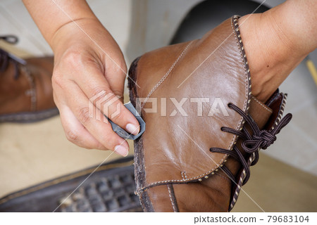 reparing the torn boots reparing the torn boots 79683104