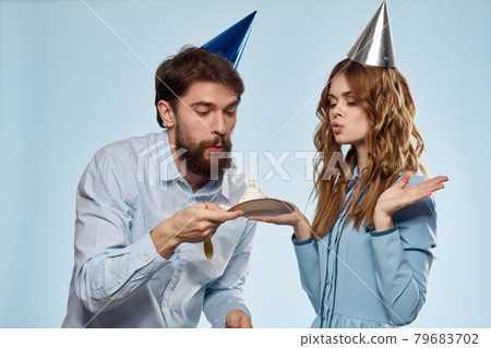 Birthday corporate young man and woman with cake on isolated background disco party Birthday corporate young man and woman with cake on isolated background disco party 79683702