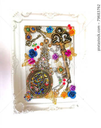 Hand mirror and key in a picture frame Hand mirror and key in a picture frame 79683762
