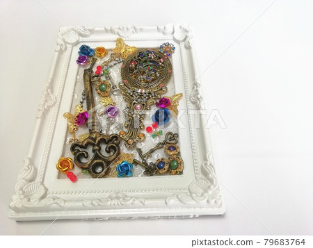 Hand mirror and key in a picture frame Hand mirror and key in a picture frame 79683764