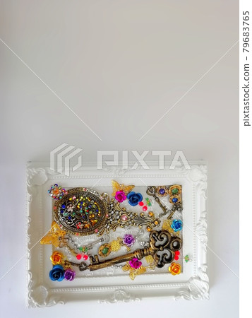 Hand mirror and key in a picture frame Hand mirror and key in a picture frame 79683765