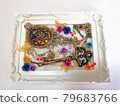 Hand mirror and key in a picture frame 79683766