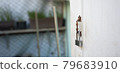 lock is hanging on house's door 79683910