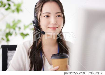 Young operator working in the office Young operator working in the office 79683917