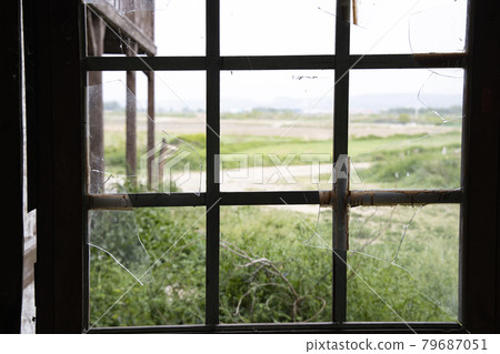 The view outside the broken window The view outside the broken window 79687051