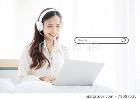 Asian women use computer laptop to find what they are interested in Asian women use computer laptop to find what they are interested in 79687533