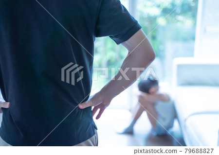 A girl crouching and crying, and adults watching her 79688827